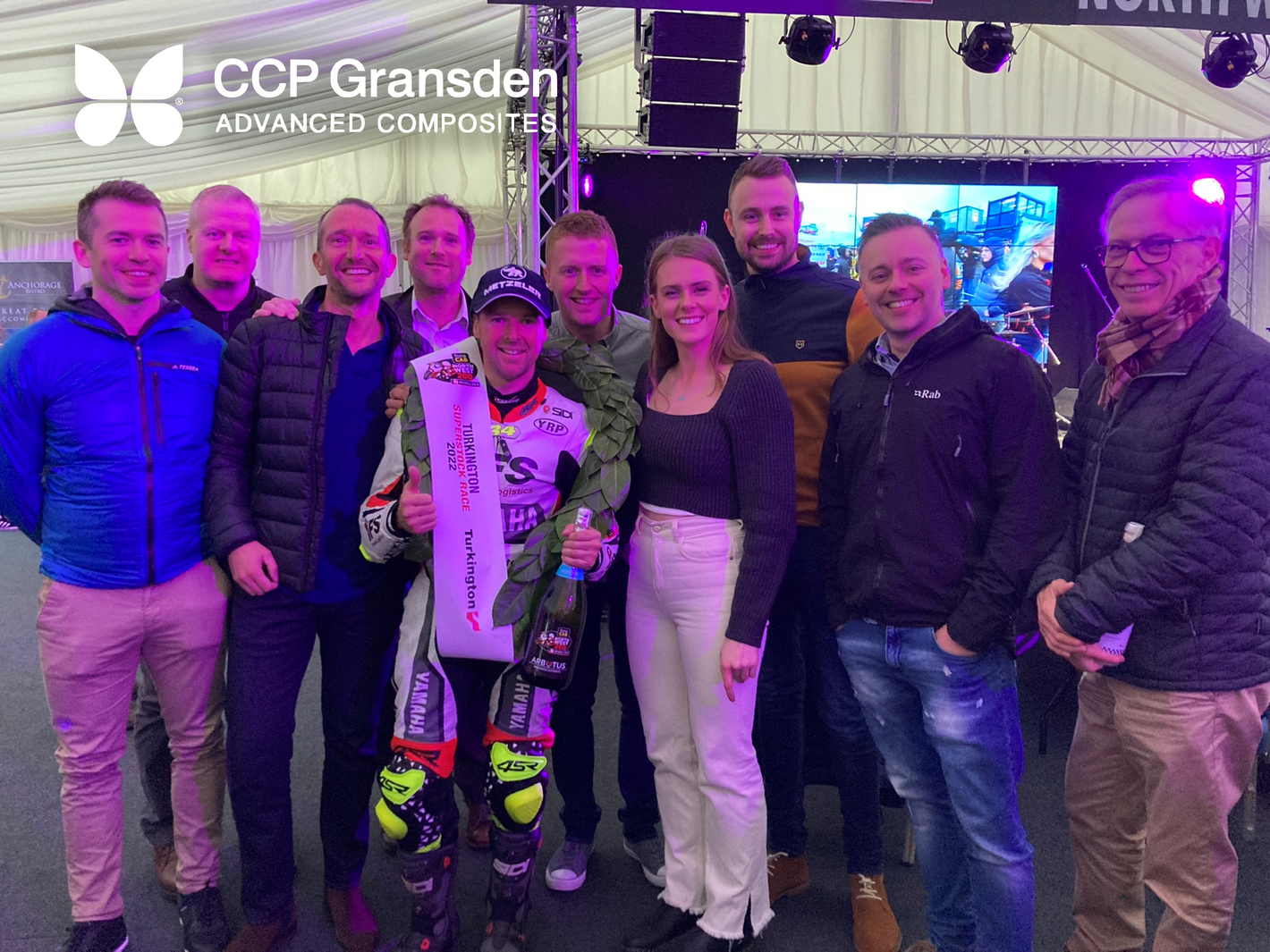 A selection of CCP Gransden employees and guests in The North West 200 corporate marquee with winning local racer Alastair Seeley