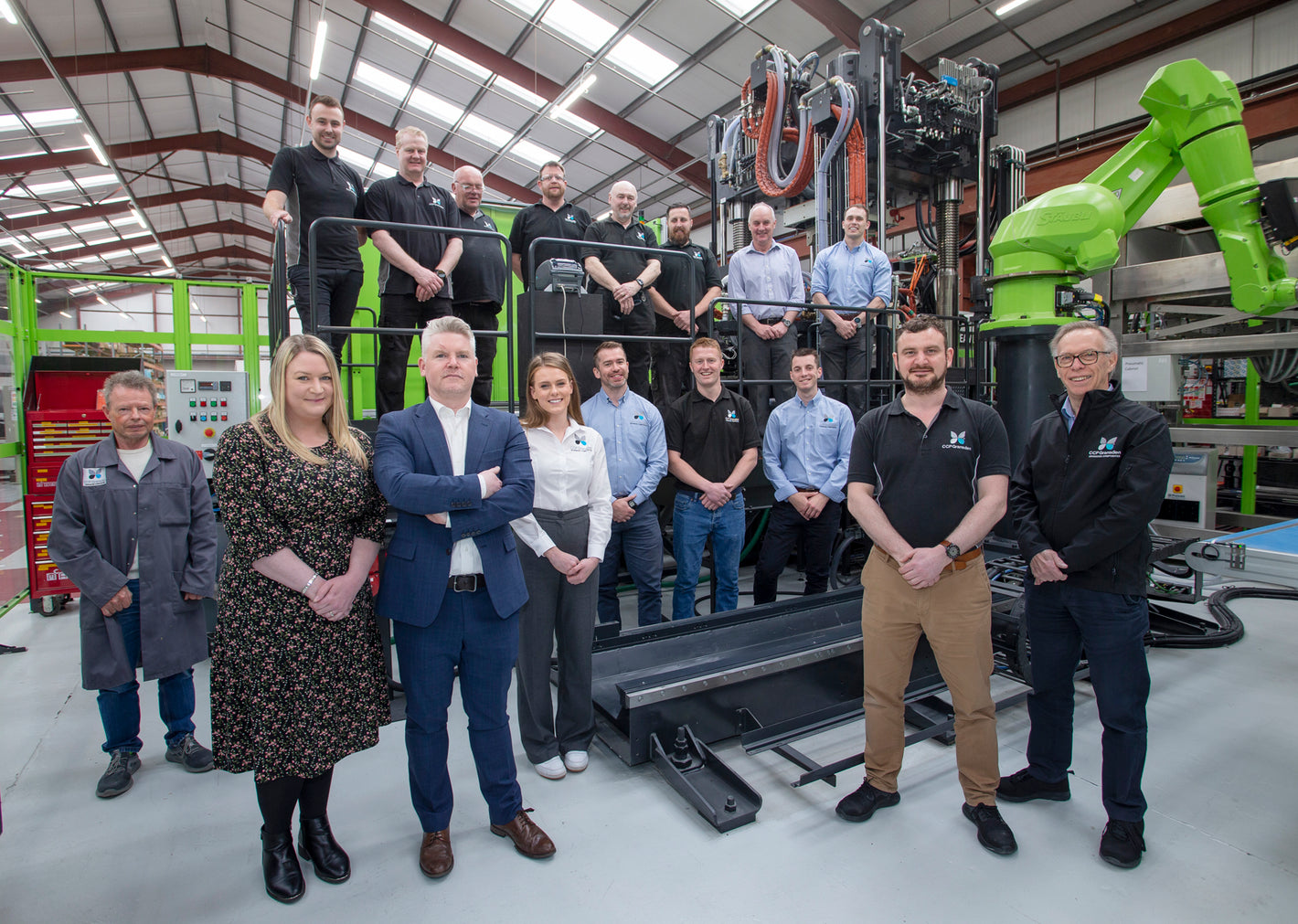 A photo of some of the CCP Gransden team stood in front of the Engel Press on the factory floor