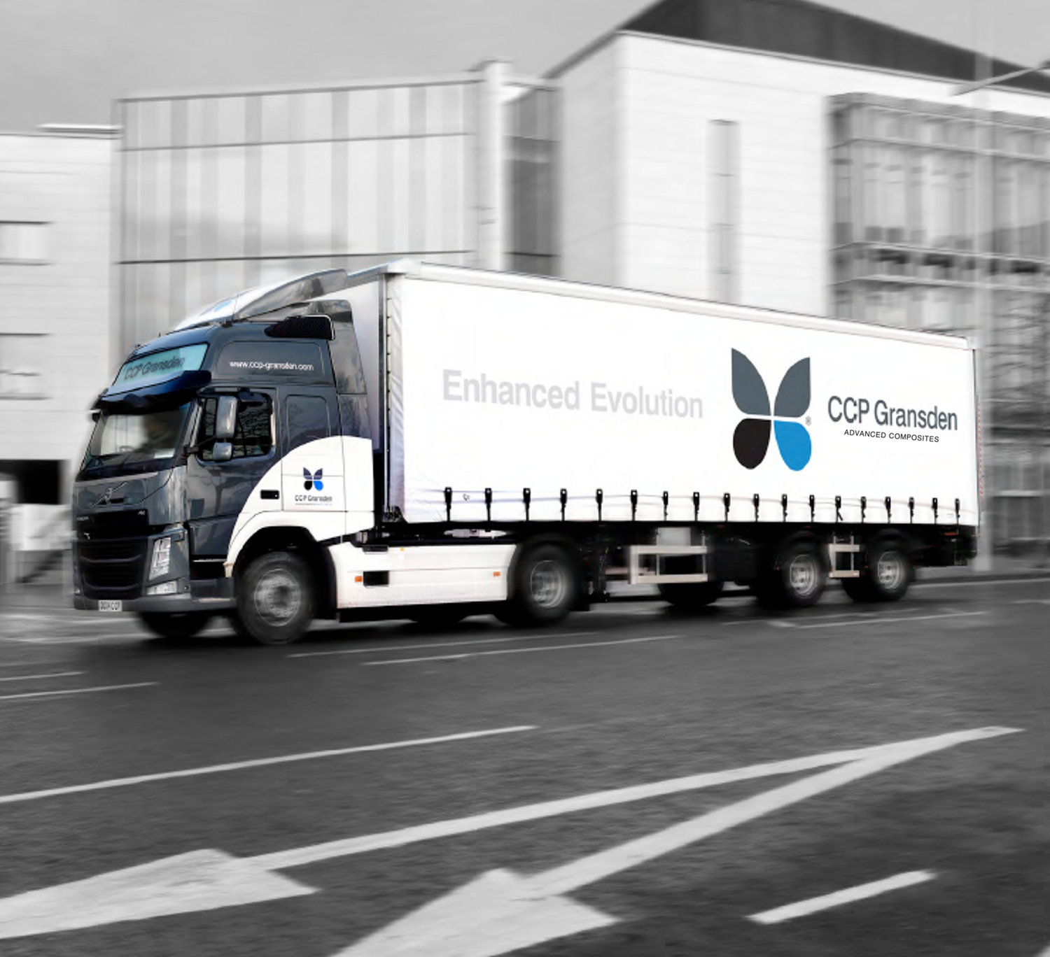 CCP Gransden's truck with it's butterfly logo livery drives through a city delivering composite parts